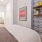 Large bedroom with closet space and floating shelves 