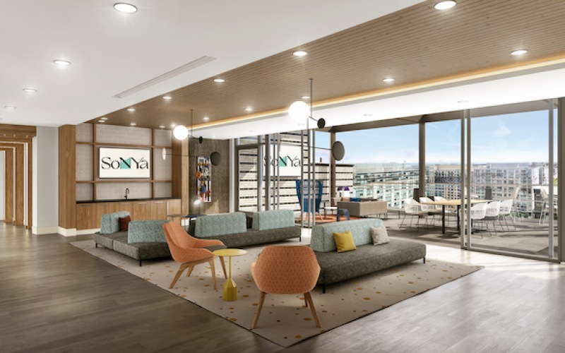 Lounge with wood floors and large windows 