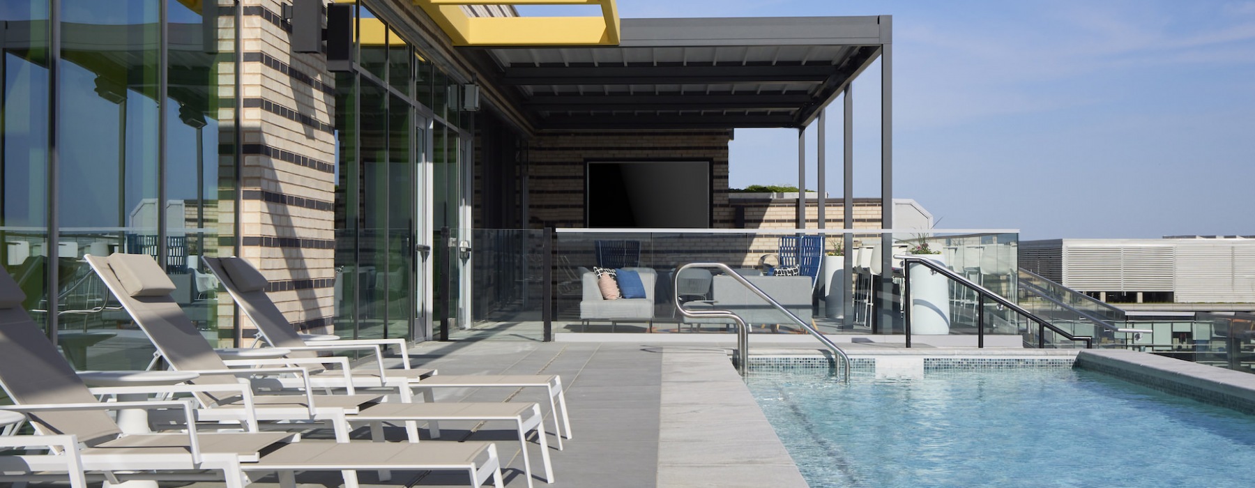 Rooftop pool with seating terrace and views 